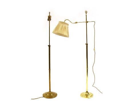 A brass height adjustable reading lamp with extendable arm, on a circular weighted base,158cm high and another with a twin li