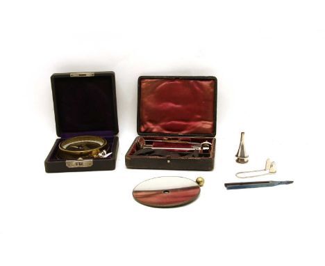 A 'dip needle' mining compass, by WS Darly &amp; Co, Chicago, USA, 8.5cm diameter, and a leather cased dentist's tool set, by