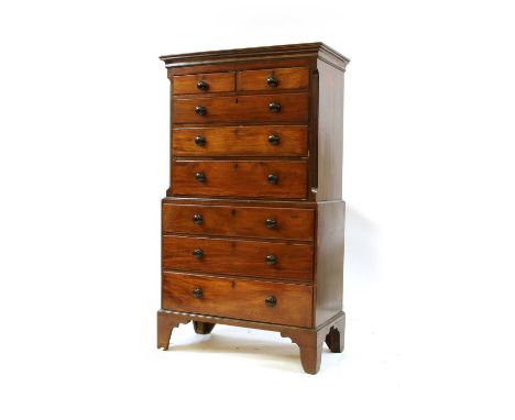 A 19th century mahogany chest on chest, two short over six long drawers, enclosed by fluted angles, all raised on bracket fee