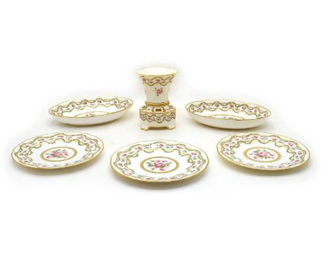 A Minton china dessert service, painted in polychrome enamels with pink roses and highlighted in gilt, comprising an oval two