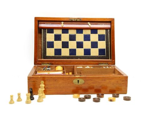 A mahogany cased games compendium, with fan and quarter fan inlaid decoration, complete with chess, dominoes, draughts, whist