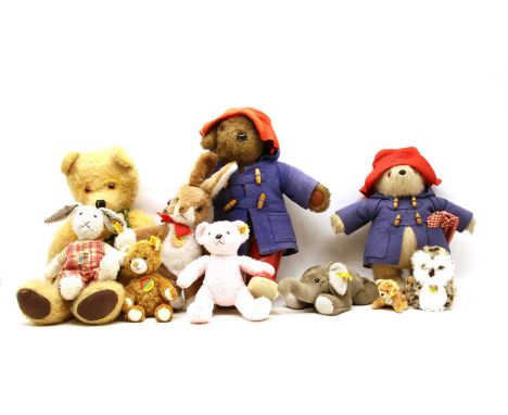 A collection of soft toys, to include a Paddington bear with red hat, blue duffle coat and red wellington boots, 55cm high, a