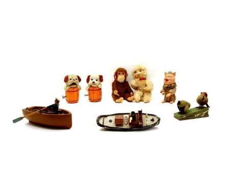 Various toys, comprising: 2 Japanese tinplate clockwork puppies in barrels, 12cm high, a monkey, pig, lamb and 2 chicks, toge
