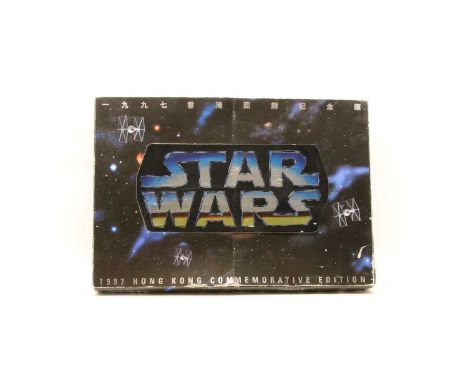 A 1997 Kenner commemorative set, produced to mark the handover of Hong Kong from Britain to China, three individual 12" figur