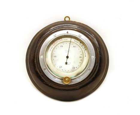 An aneroid barometer by JW Ray &amp; Co, Liverpool, 9cm silvered register dial too a stained wood mount, 17.5cm diameterCondi