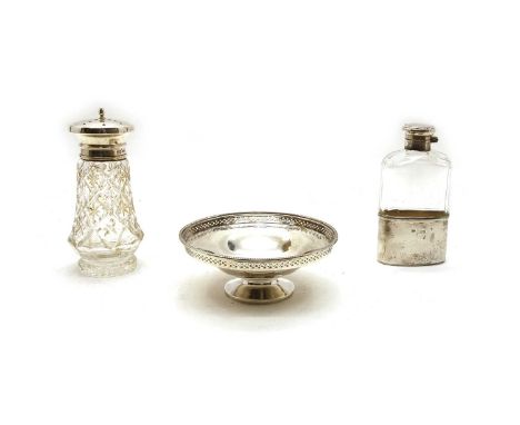 A silver mounted hip flask, 13.5cm high, a silver mounted sugar castor, 15.5cm high, a silver dish, with a pierced rim, 13.5c