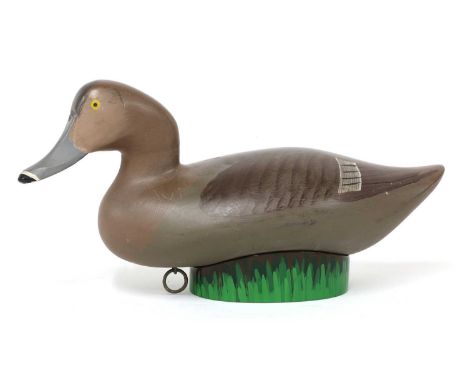 Redhead decoy, by Captain Harry Jobes (1936-2019), Maryland Shore, with ring and lead weight, on a painted resin stand, with 