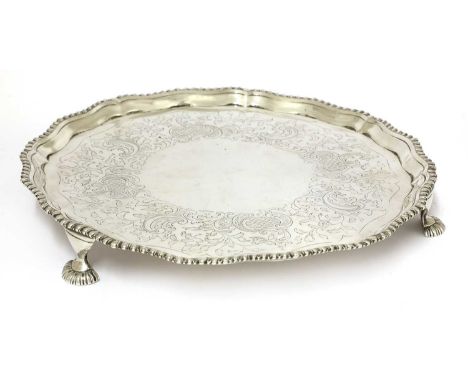 A George III silver salver, Elizabeth Cooke, London, 1771 with a gadrooned rim and engraved with scrolling foliate designs, r