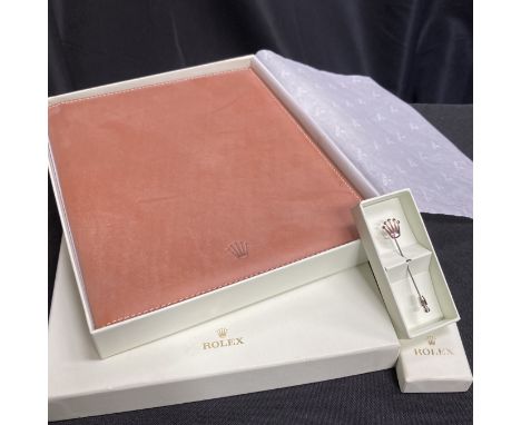 A ROLEX LEATHER NOTEPAD, together with A ROLEX TIE-PIN, both in original boxes.&nbsp;(2)