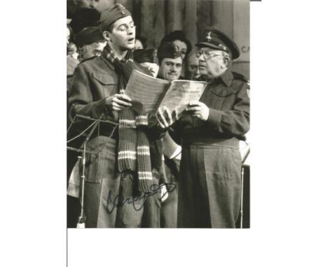 Dads Army Ian Lavender as Private Pike signed 10 x 8 inch b/w photo singing with Arthur Lowe. Good Condition. All signed piec