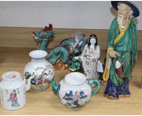 A group of Asian ceramics, comprising a a Kutani group of an immortal and lion dog, a similar teapot and cover, a Chinese san