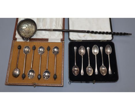 Two cased sets of six silver spoons and a white metal toddy ladle.
