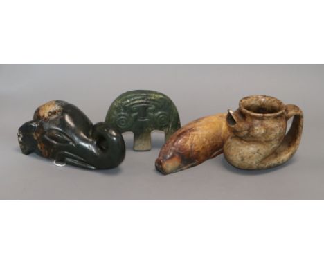 Four Chinese archaistic jade or hardstone zoomorphic carvings, including a pig, elephant head, a ewer etc. largest, elephant 