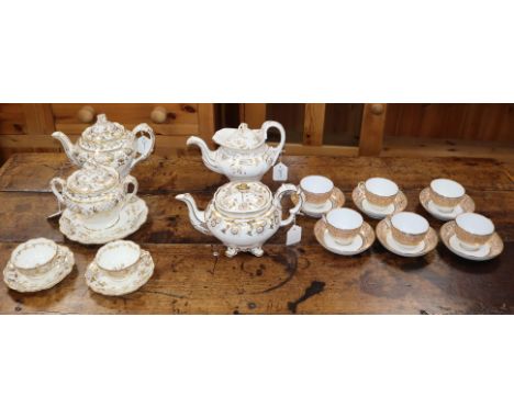Various 19th century gilt and white tea wares, some banded in pink, including pots, cups, saucers, sucrier etc