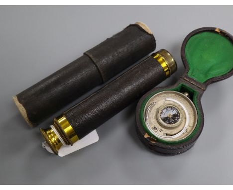 A pocket barometer, thermometer and compass in leather case and a gilt brass three-draw telescope telescope 14.5cm long (clos