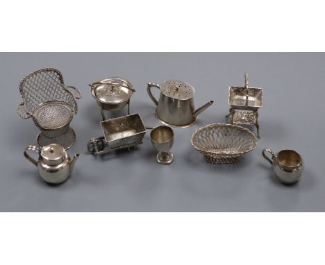 A group of novelty miniature silver and white metal items, including a basket on stand with pseudo Hanau marks, a late Victor