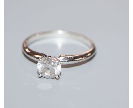 A 14k white metal and solitaire diamond ring, stone diameter approximately 5.7mm, size K/L.