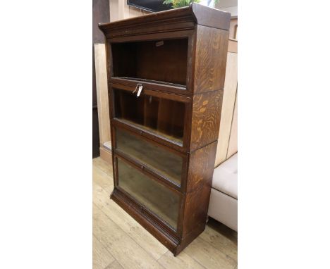 A Globe Wernicke style oak four section bookcase W.86cm