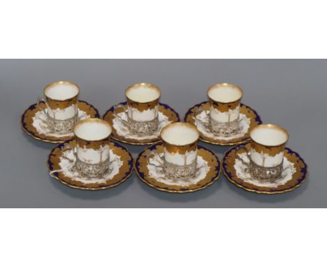 A set of six Aynsley silver mounted porcelain coffee cans and saucers