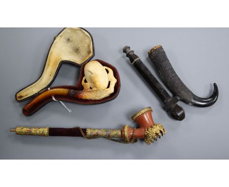 A carved Meerschaum pipe and two other pipes Meerschaum pipe 14cm long