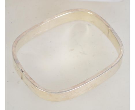 A 925 silver contemporary bangle. Marked 925. Weight 19.4g. Diameter widest point 7cms.