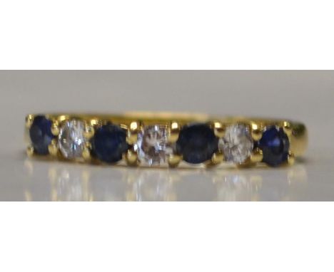 A hallmarked 18ct gold, blue sapphire and diamond ring. Hallmarked for London. Diamonds approx 15pts. Maker AC&Co.  Size K. W