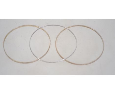 A group of three silver bangles, all three stamped 925, with geometric engine turned design