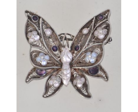 A vintage 925 silver filigree and enamel butterfly brooch with roller clip clasp. Marked 925 S. Measures 3.5cms. Weight 5.4g.