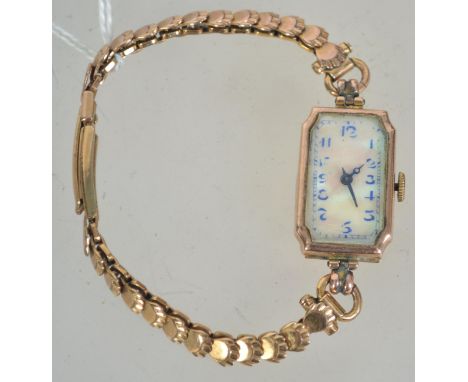 A hallmarked Art Deco 9ct gold cocktail watch having a MOP enamel face with a  Swiss 10 Jewel movement on a French clam shell