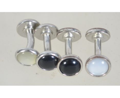 Four vintage white metal shirt studs cufflinks with mother of pearl and black end caps. Weight 8.9g.