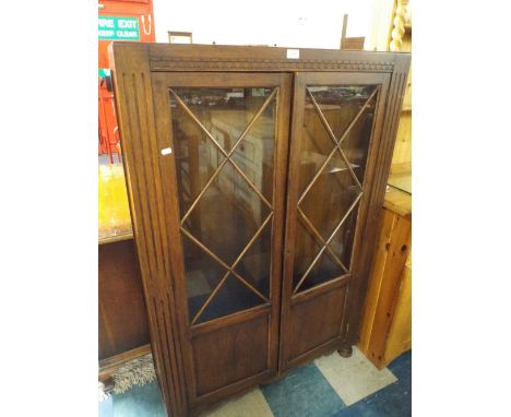 An Art Deco Oak Glazed Bookcase.
