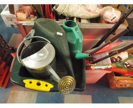 A Collection of Garden Equipment to Include Watering Cans Garden Tools Shelf Racking Etc. 