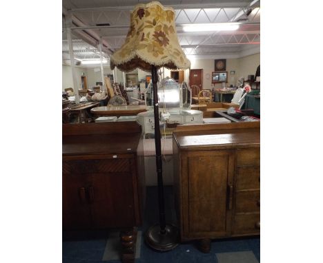 A Mahogany Standard Lamp and Shade.