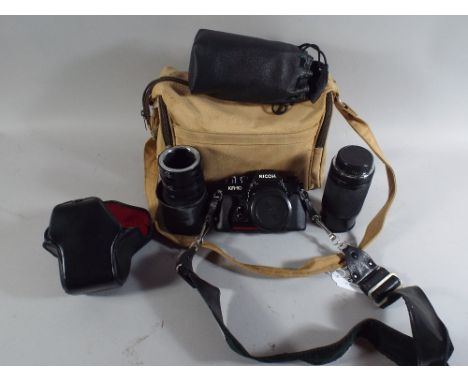 A Ricoh 35mm Camera, Lenses, Carrying Case, Flash Gun.