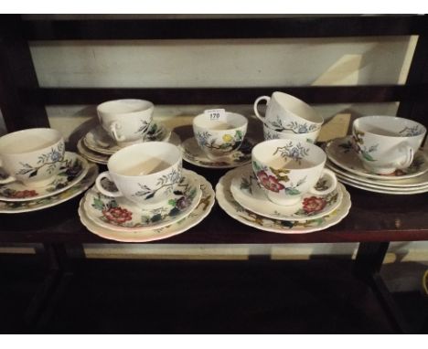 A Collection of Floral Pattern Trios to Include Eight Side Plates, Seven Saucers and Eight Cups. 
