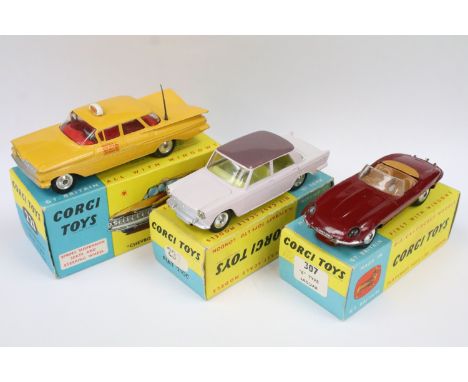 Three boxed Corgi diecast models to include 221 Chevrolet New York Taxi Cab (vg), 307 E Type Jaguar in dark red (play worn, w