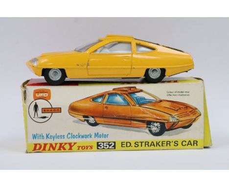 Boxed Dinky 352 Ed Straker's Car diecast model in yellow body, black engine covers, silver trims and pale grey interior, gd c