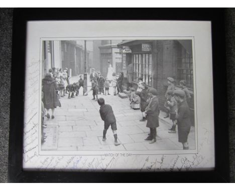 CRICKET AUTOGRAPHS Large framed black and white photograph showing British youngsters playing street cricket in the 1920s or 