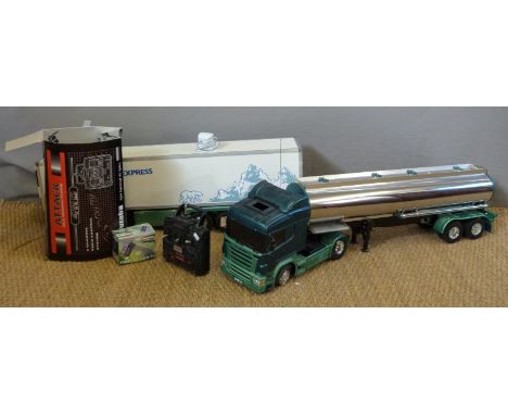 A large scale remote controlled lorry with Polar Express trailer and chromed tanker together with a Futaba 4 Chanel Radio Con