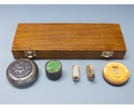 Two muzzle loading paper cartridges 13 gauge and Eley's 18 gauge together with a tin of Eley Surefire primers, an F Joyce & C