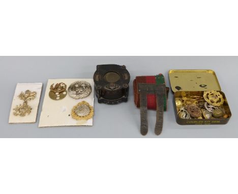 A collection of items including Royal Tank Regiment stable belt compass (possibly from ship or aircraft) 15 cap badges/belt b