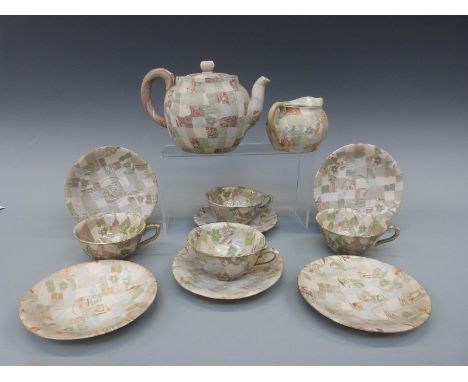 Japanese Agate ware Nerikomi porcelain part tea set to include teapot, jug, four cups and six saucers