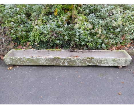 A carved natural stone trough (L275 x W43 x H20cm)