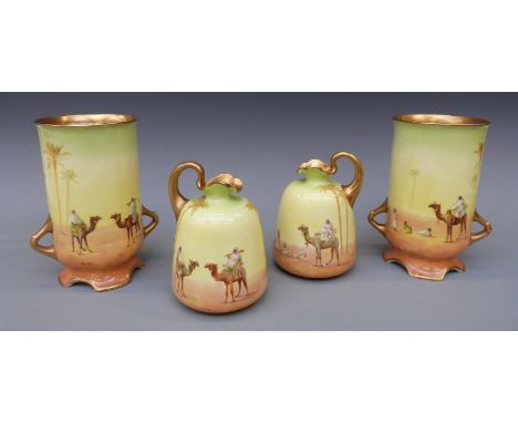 Two pairs of early 20thC Royal Doulton vases with print and enamel decoration of desert scenes and gilt handles, largest appr