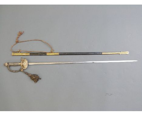 Victorian officer's sword with ornate brass hilt & guard, wired handle and tassel, the 80cm blade decorated and engraved with