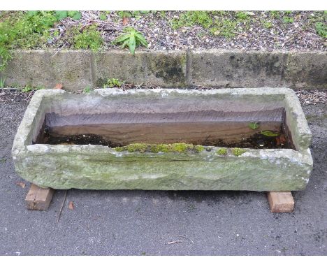 A carved natural stone trough (L105 x W44 x H20cm)