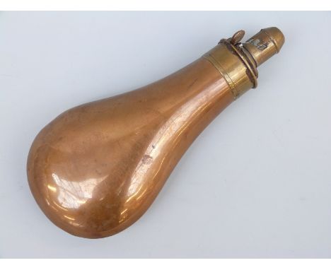 Copper and brass powder flask stamped 'Snider' under a gun logo, 19cm long.  