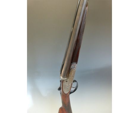 Victor Sarasqueta 12 bore side by side sidelock ejector shotgun with named and engraved locks, all over scrolling engraving, 