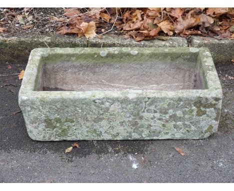 A small rectangular carved natural stone trough (L71 x W36 x H20cm)