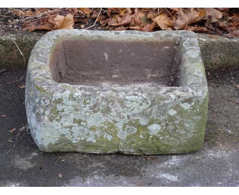 A small D ended carved natural stone trough (L53 x W46 x H20cm)